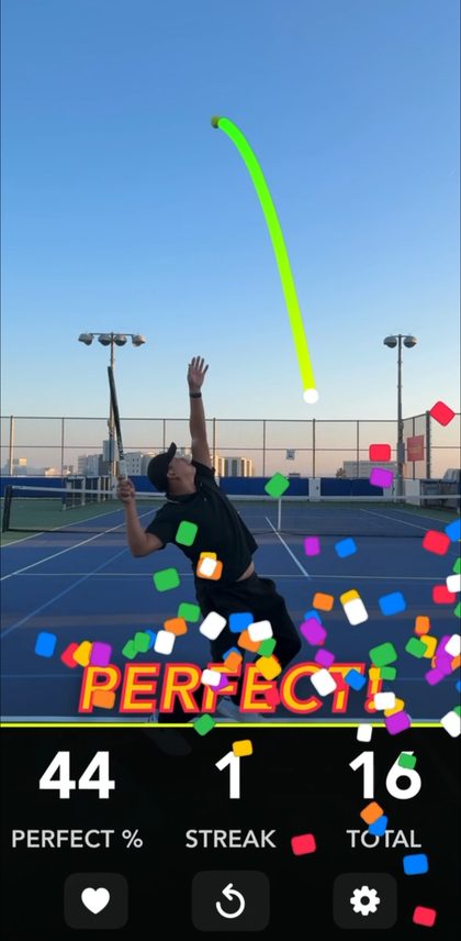 TossBuddy in kick serve mode, the toss traced back over the head
